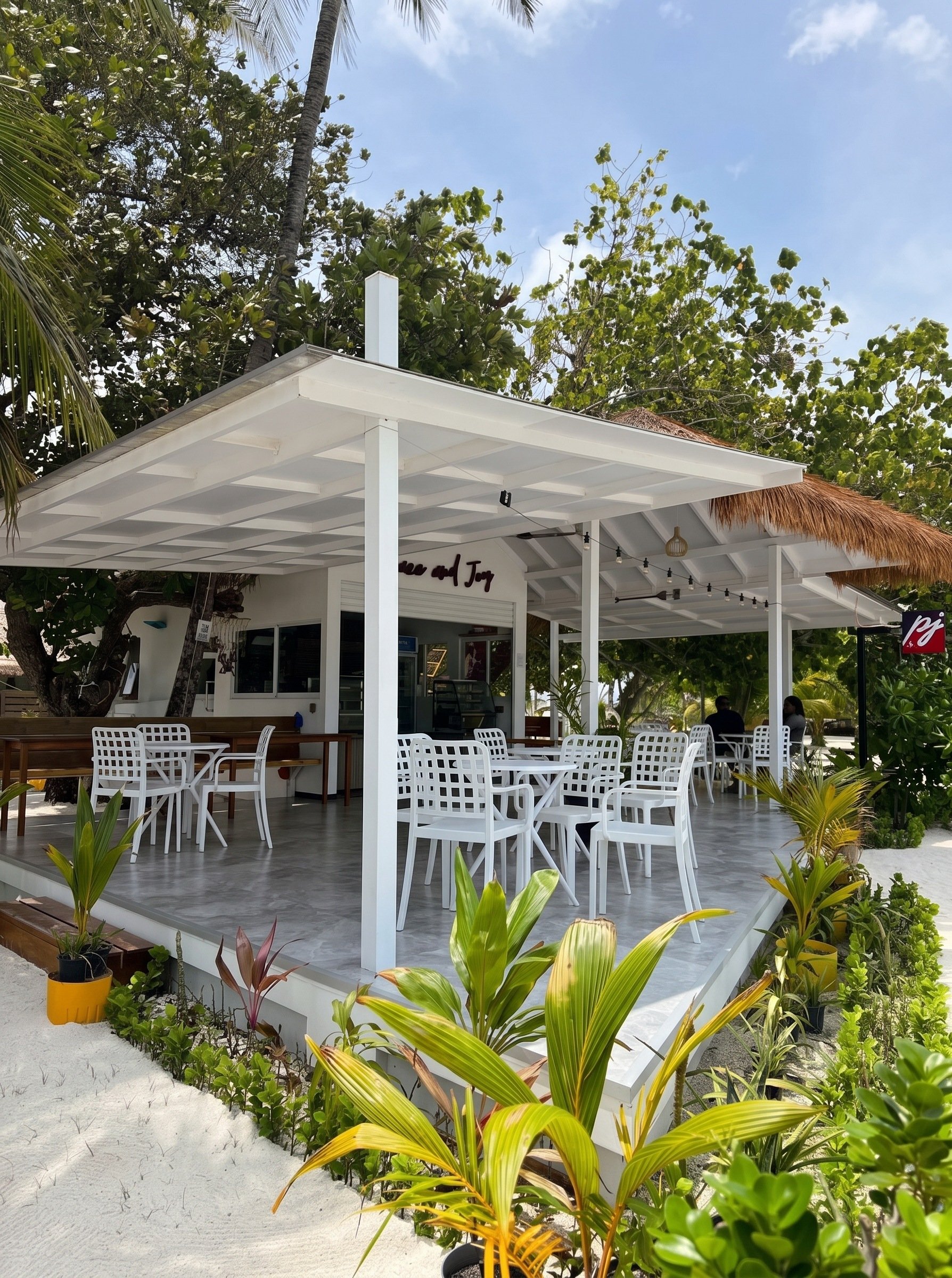 The deck today, a white metal frame with plastic chairs