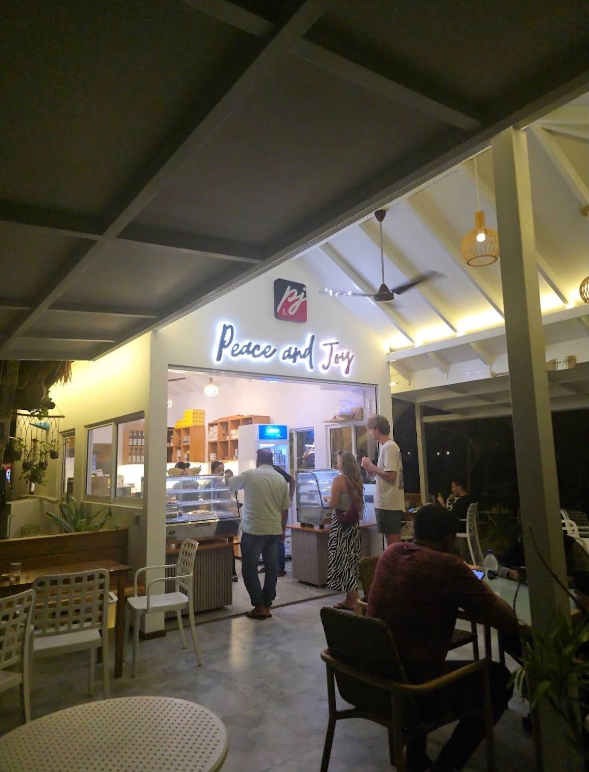 The cafe at night today, under white lights