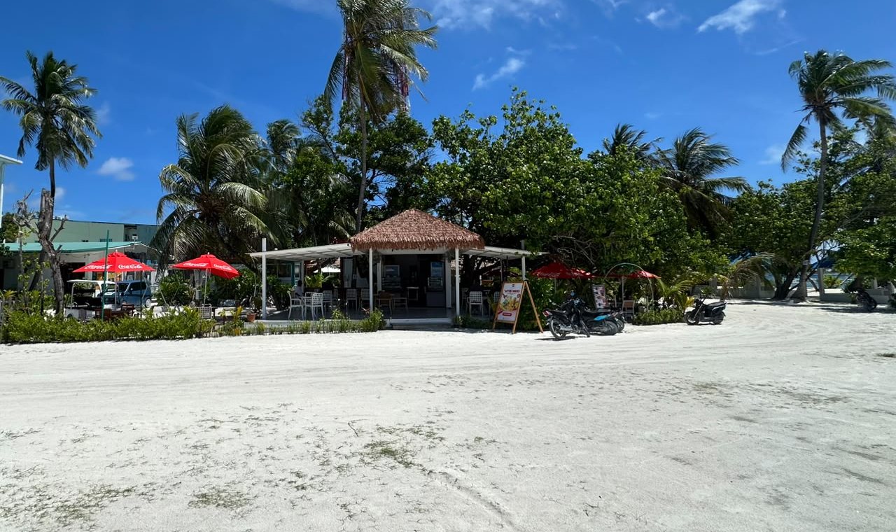 The current cafe building on its sandy corner plot in Thulusdhoo