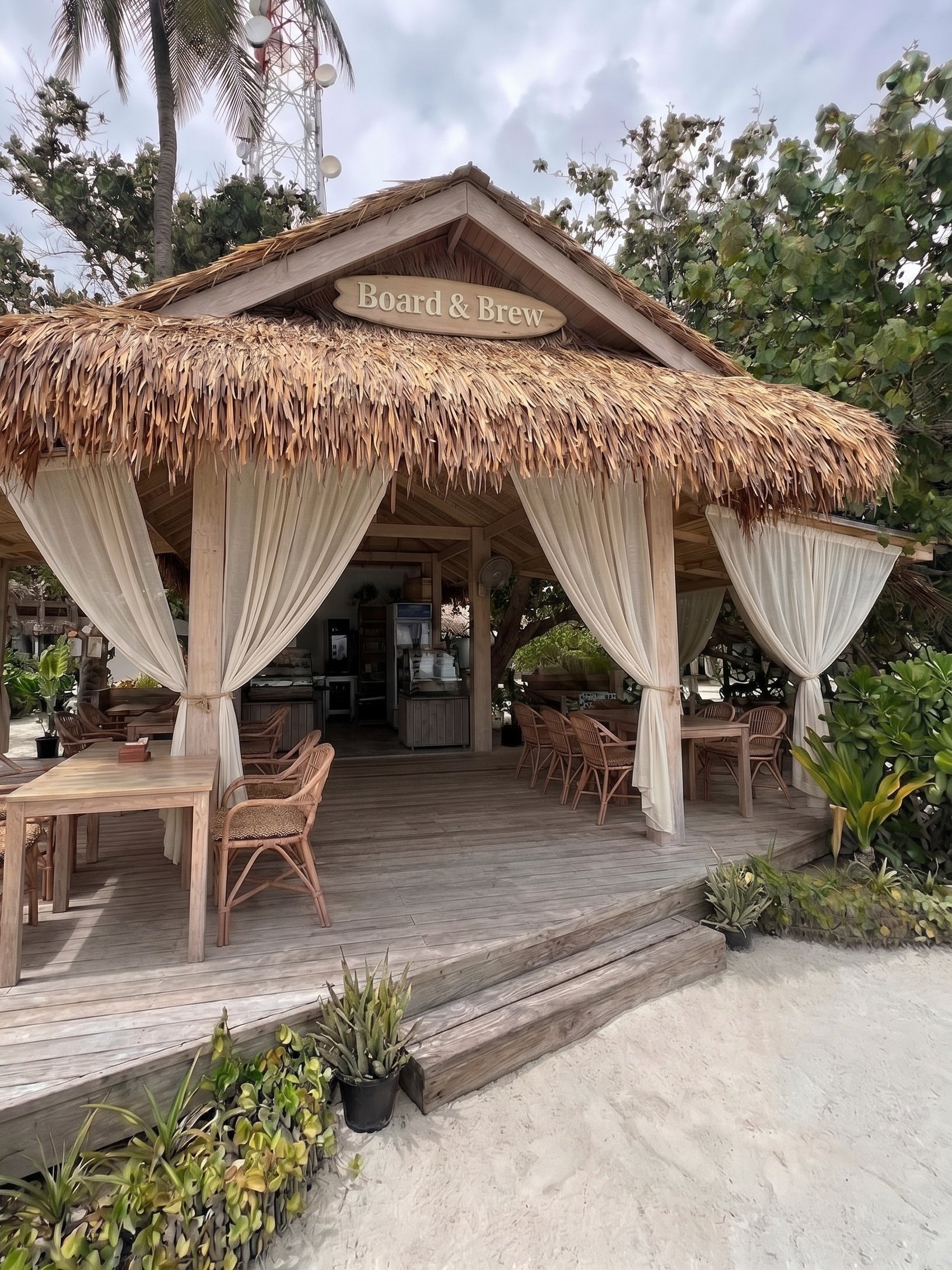 Render of the rebranded Board & Brew front with a thatched pavilion, timber deck and linen drapes